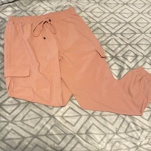 Pink polyester pants, mediums sized. Very comfortable with spandex waistband.